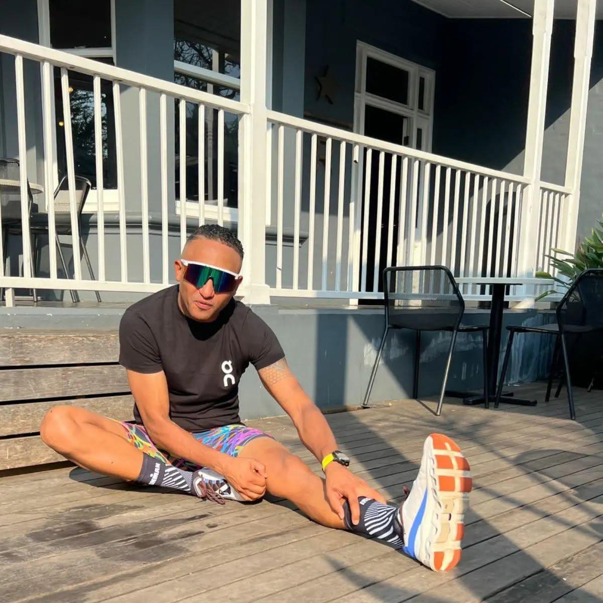 Stretching on the Feed Zone porch before a run